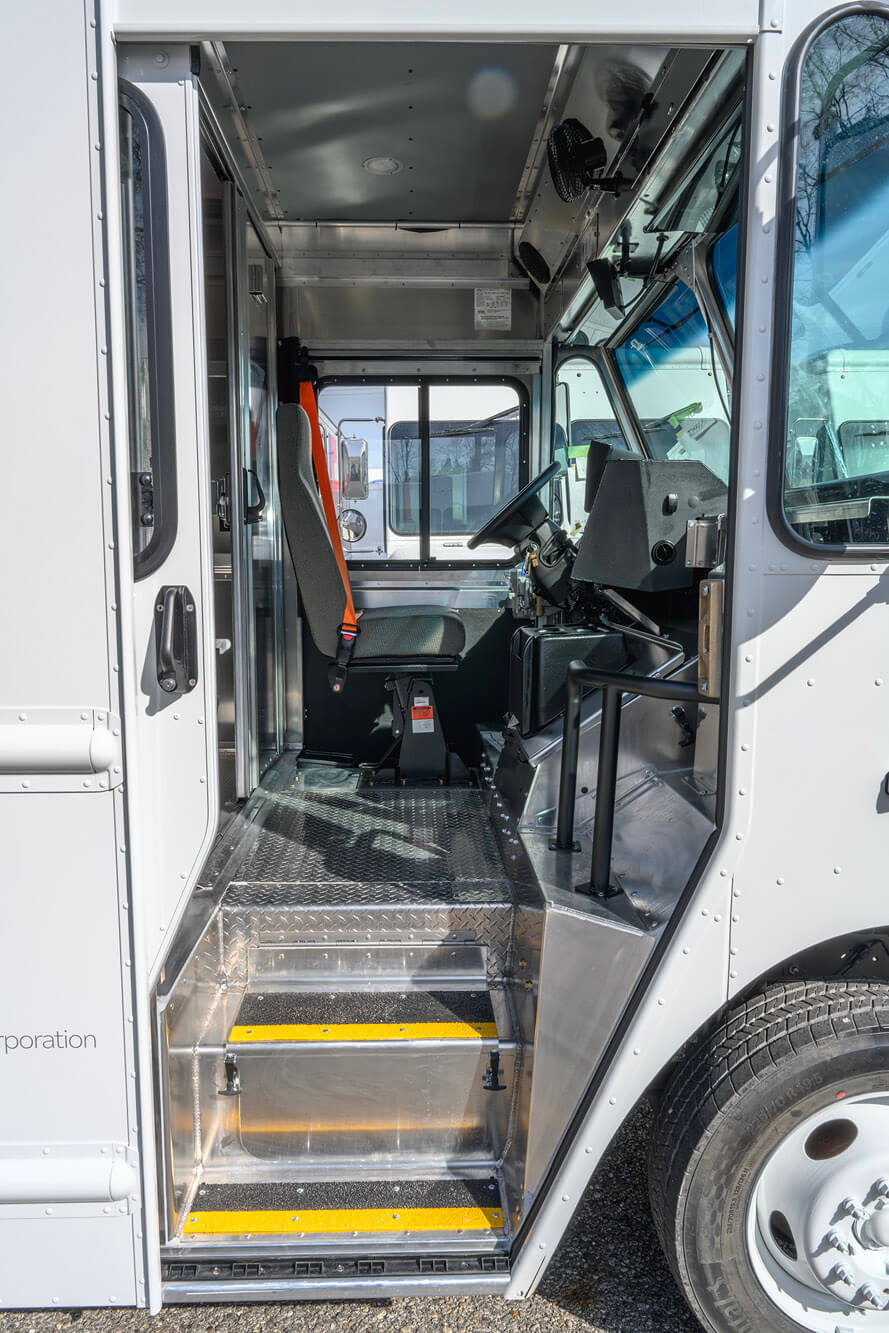 Open delivery van door showing the jumper seat where the LastFeet robot rides
